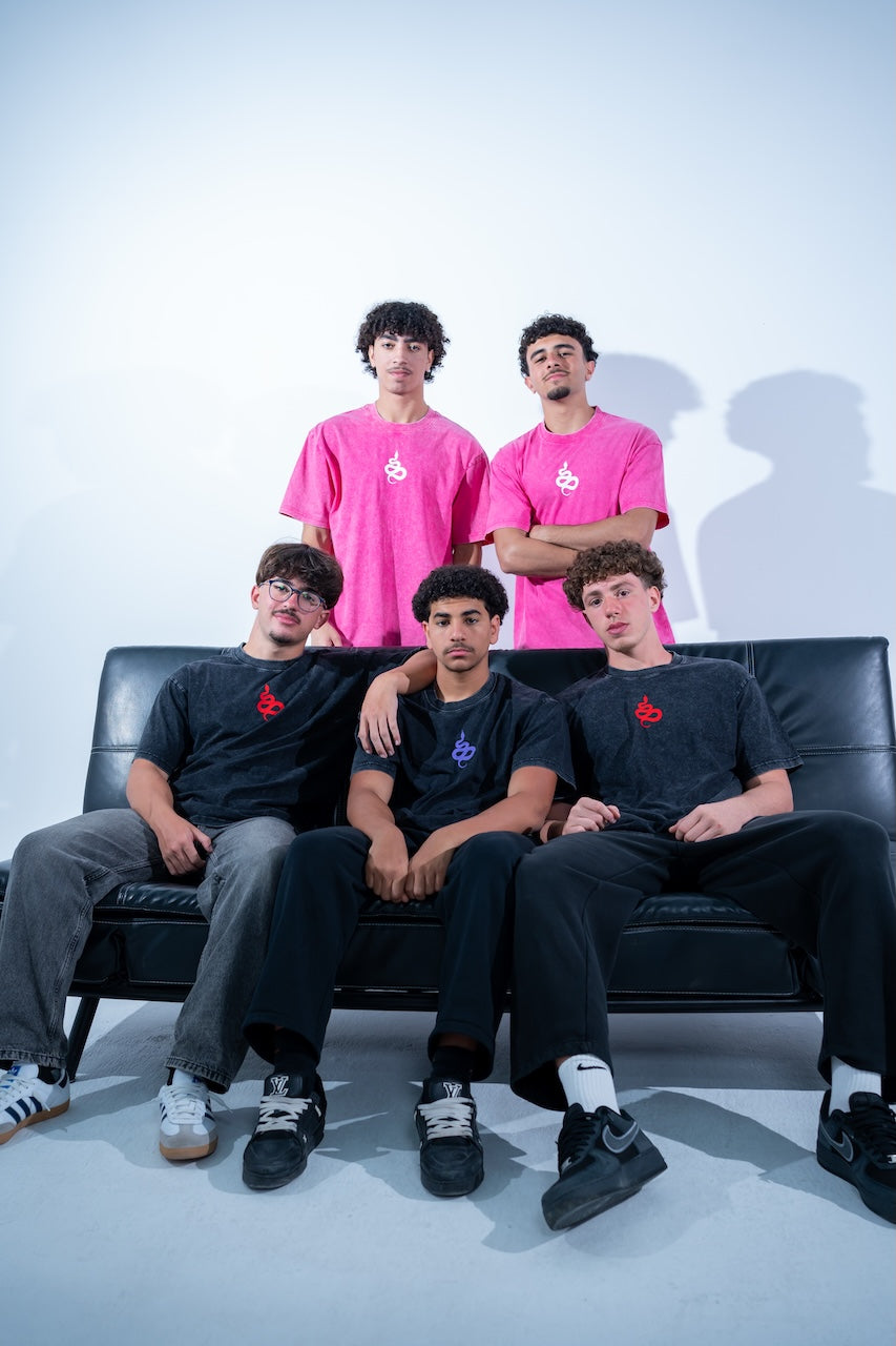 The full team on a leather sofa